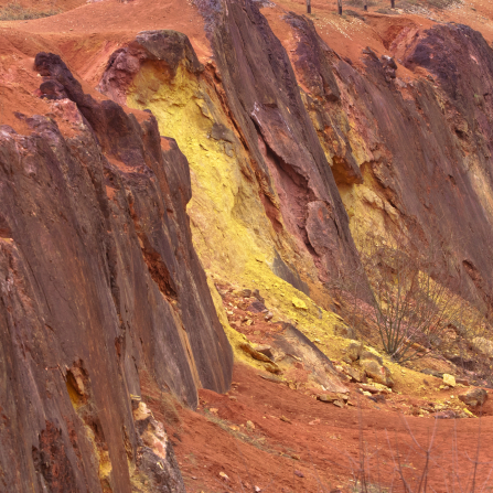 Rocky terrain with exposed reddish-brown bauxite ore
